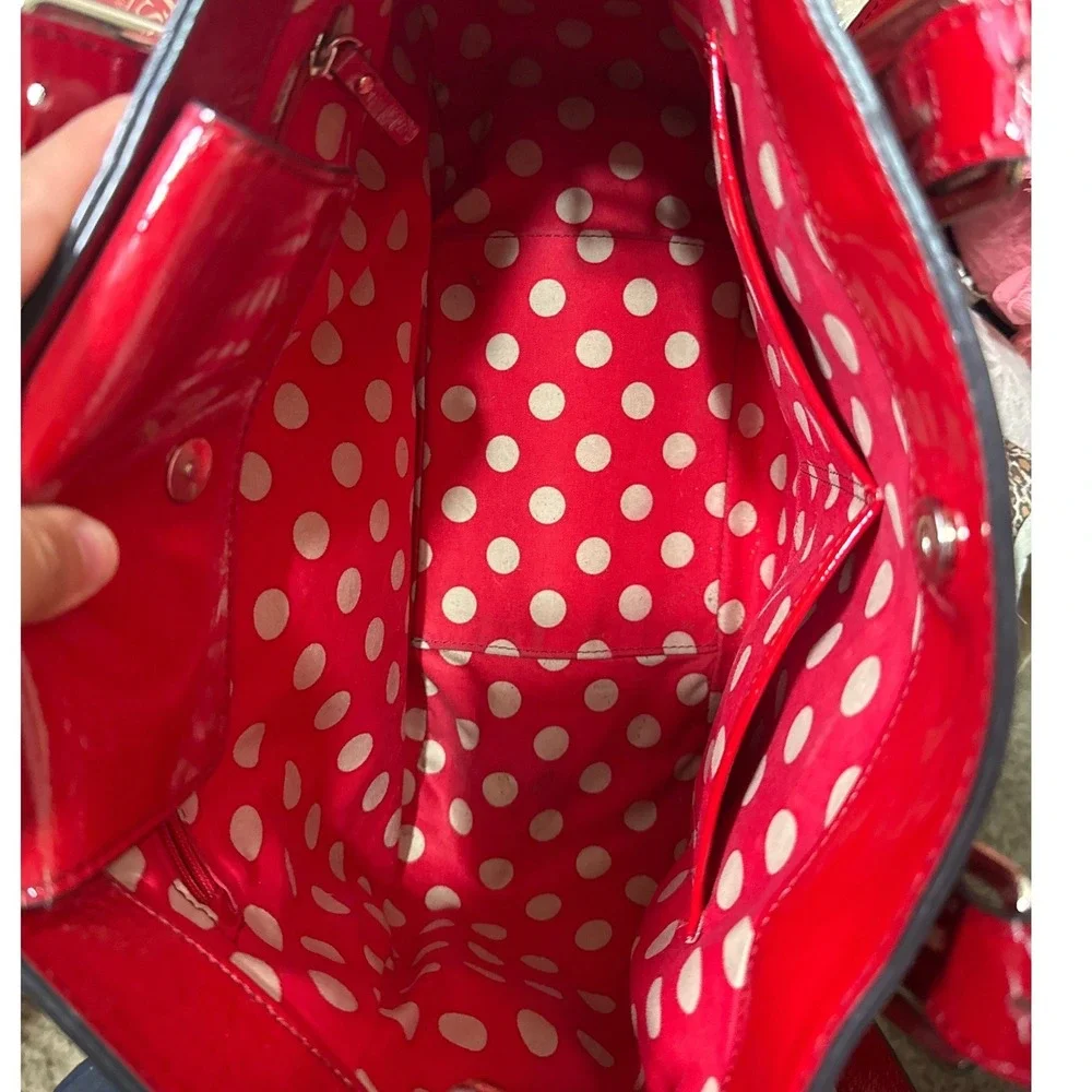 Kate Spade Carlisle Street Sylvie red patent leather satchel with shoulder strap